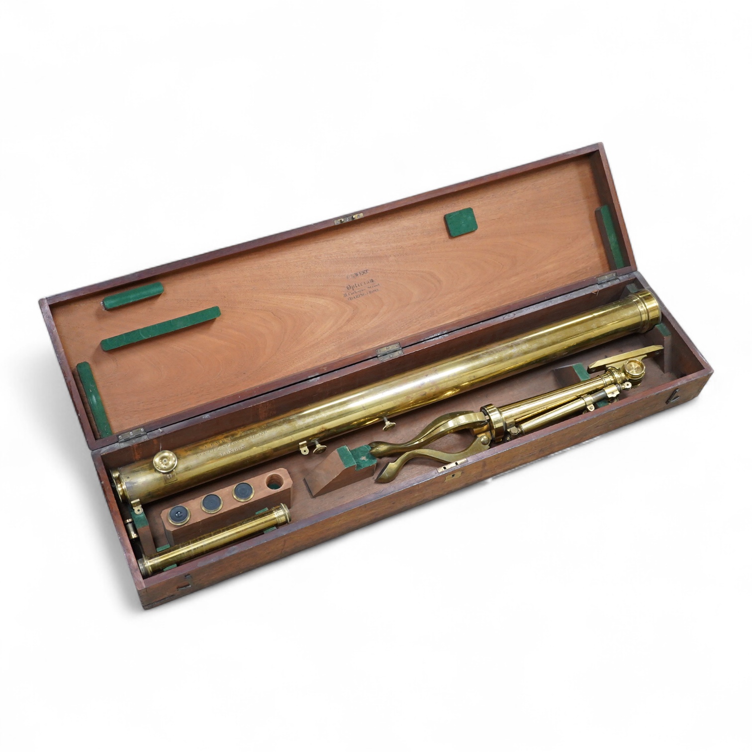 A late 19th century brass single drawer refracting telescope by F.L. West, 39 Southampton Street, Strand, London, in a fitted mahogany case, with folding brass tabletop tripod stand, and a number of alternative lenses, t